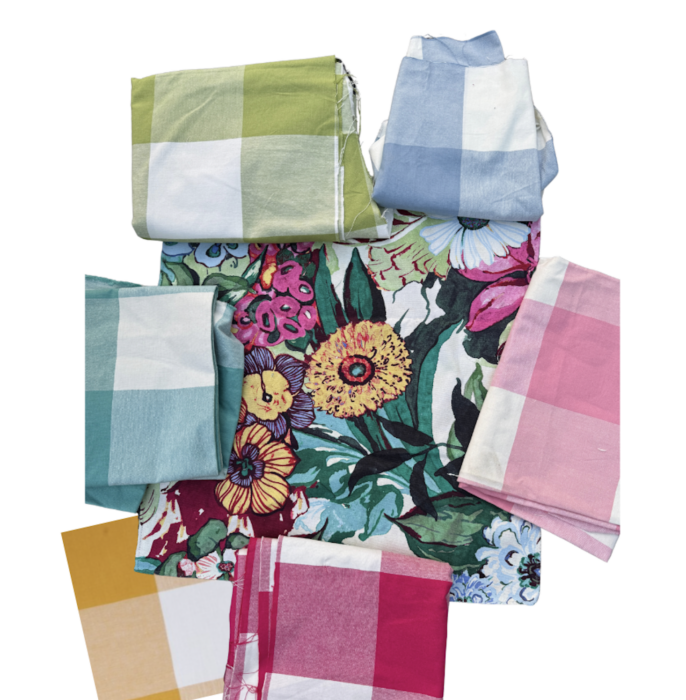 Hero fabric as the floral fabric and various buffalo check fabrics that coordinate in yellow, green, turquoise, pinks, and cornflower blue. 